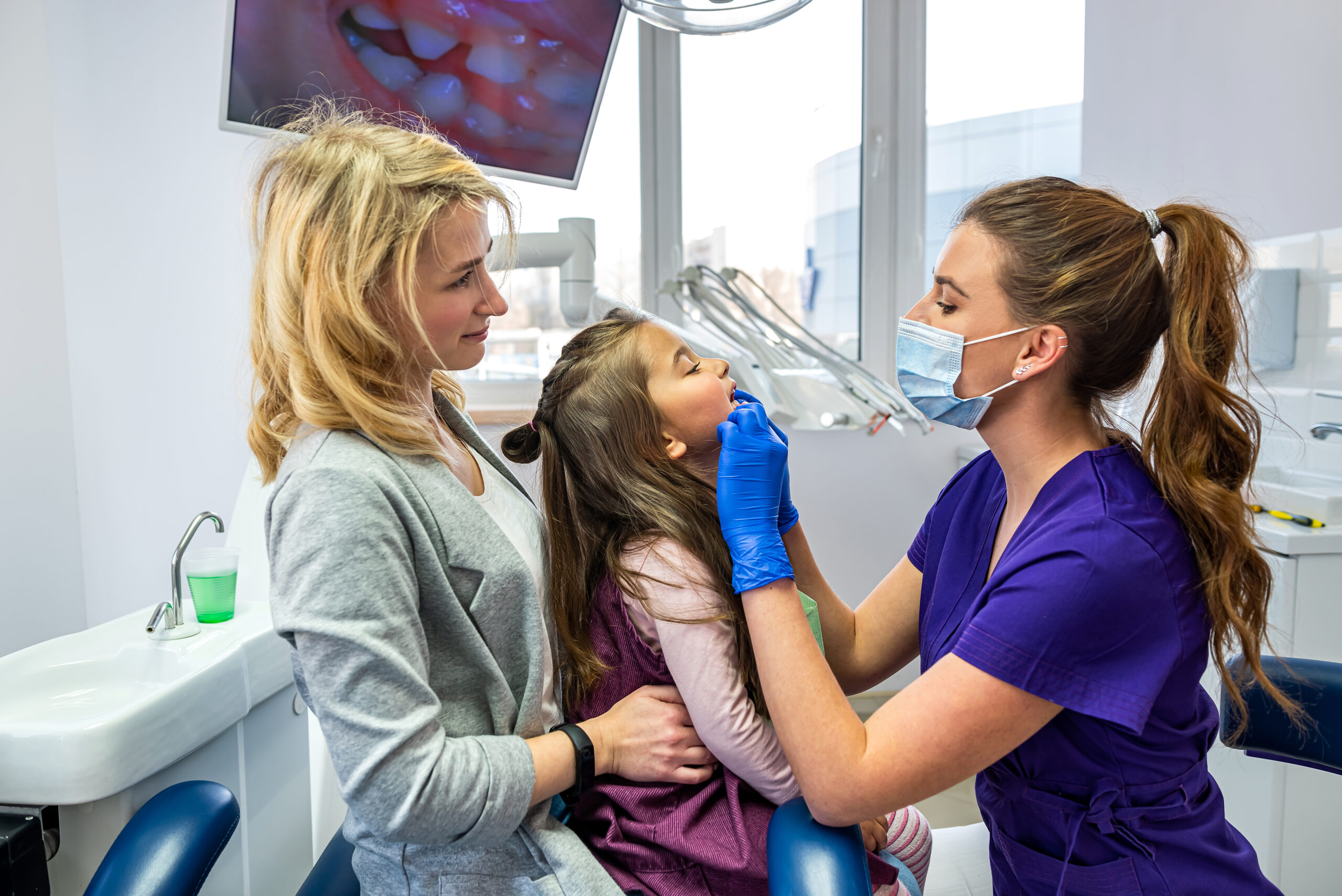 Happy child patient at paediatric dental visit